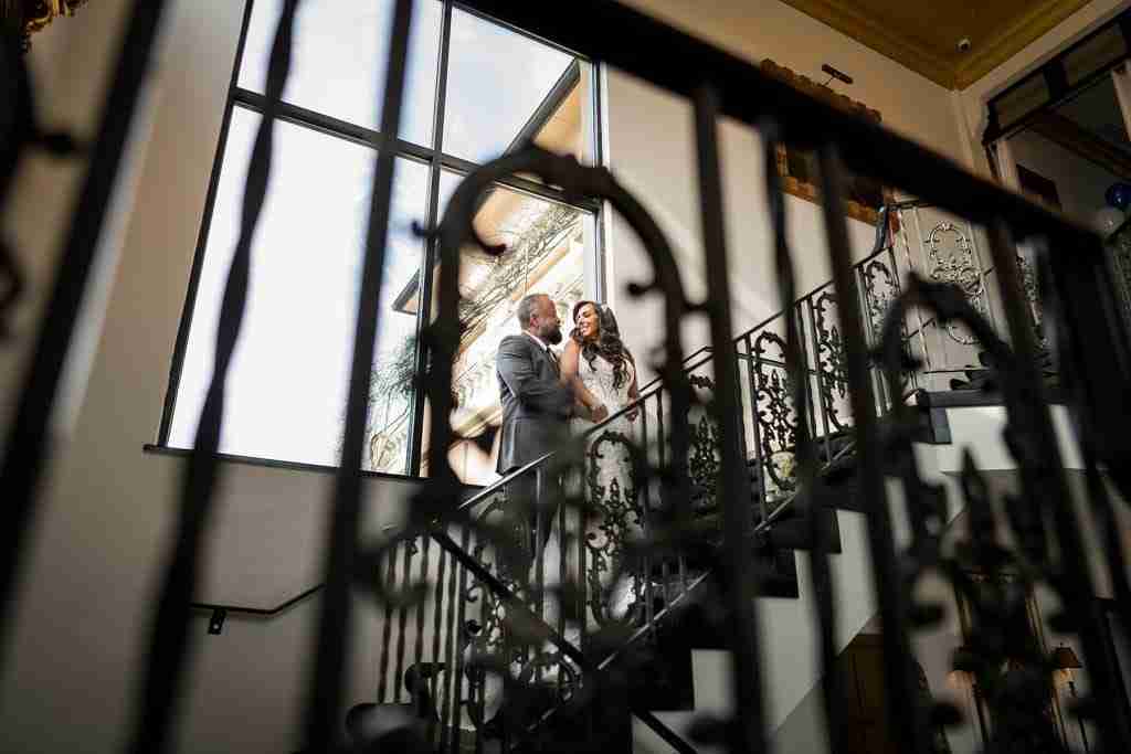 bride and groom on a staircase