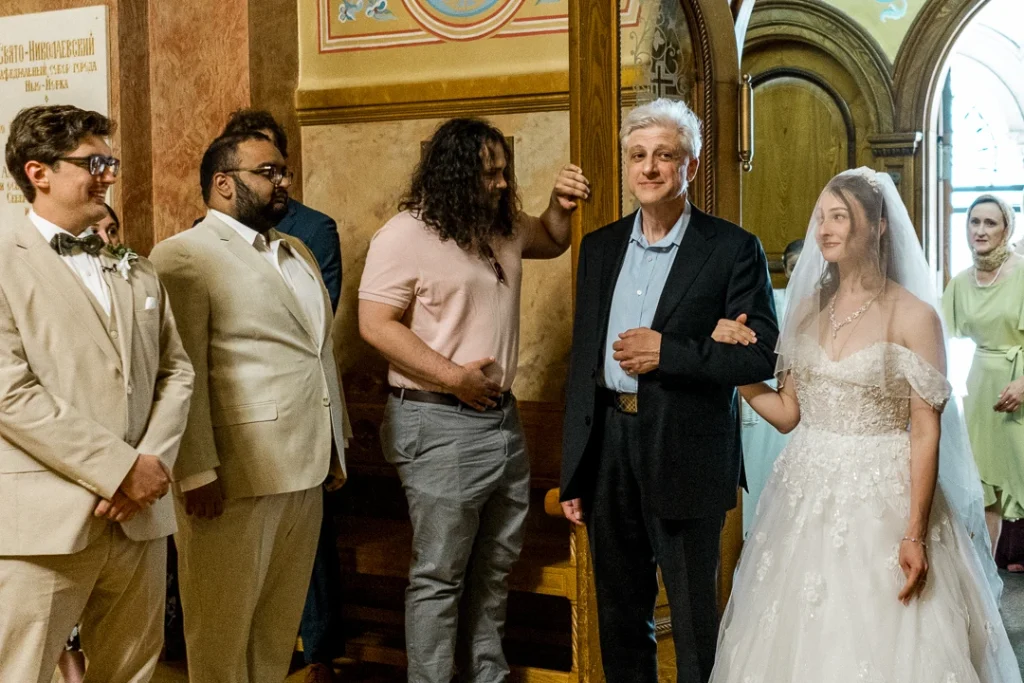 Father and bride holding hands  Wedding Photography at St. Nicholas Russian Orthodox Cathedral