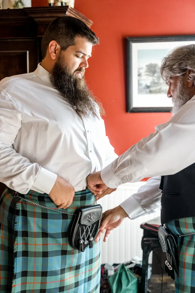 Groom and father getting ready for wedding at the Smithville Inn Wedding photography