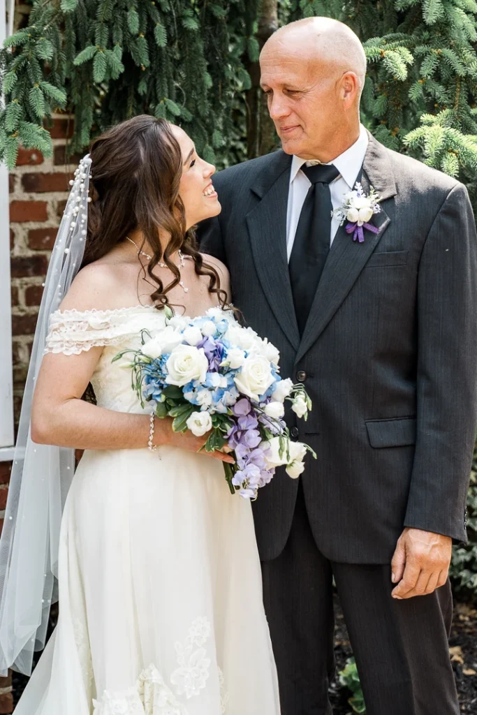 Bride and dad looking at each other right before the ceremony at the Smithville Inn Wedding photography