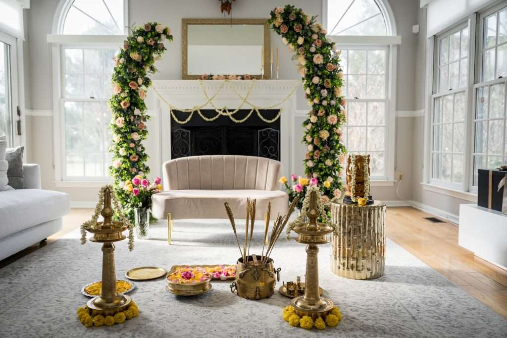Floral Elegance: An elegantly arranged engagement setting with a floral arch and traditional decorations, waiting for the ceremony to begin.