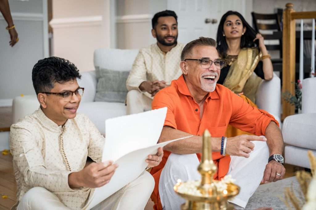 Family Laughter: A candid moment of laughter shared among family members, showcasing the joy and familial bonds celebrated during the engagement.