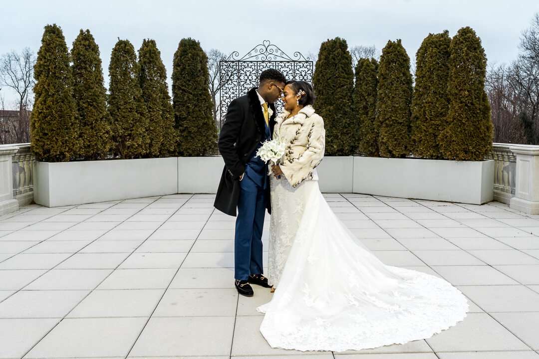 Romantic newlywed moment at The Palace at Somerset Park – The bride and groom gaze lovingly at each other on the venue’s scenic terrace