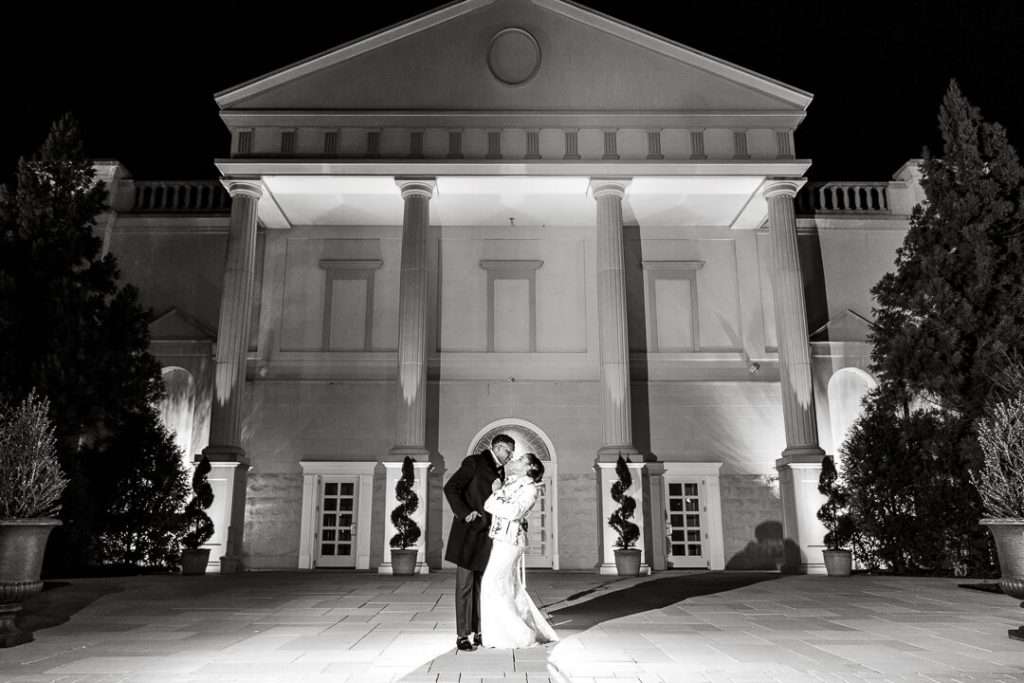 Black and white dramatic wedding shot at The Palace at Somerset Park – A striking nighttime portrait of the newlyweds, emphasizing the venue’s architectural beauty.