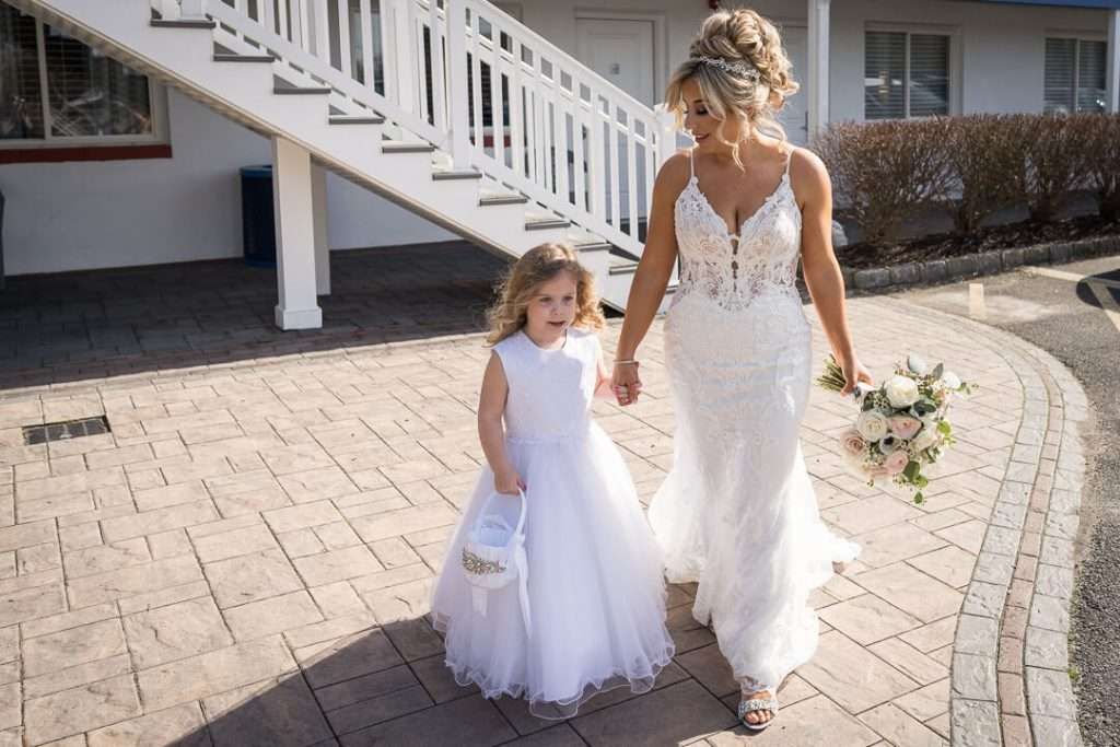 11-Crystal-Point-Yacht-Club-Bride-and-Flower-Girl-Walking-09757