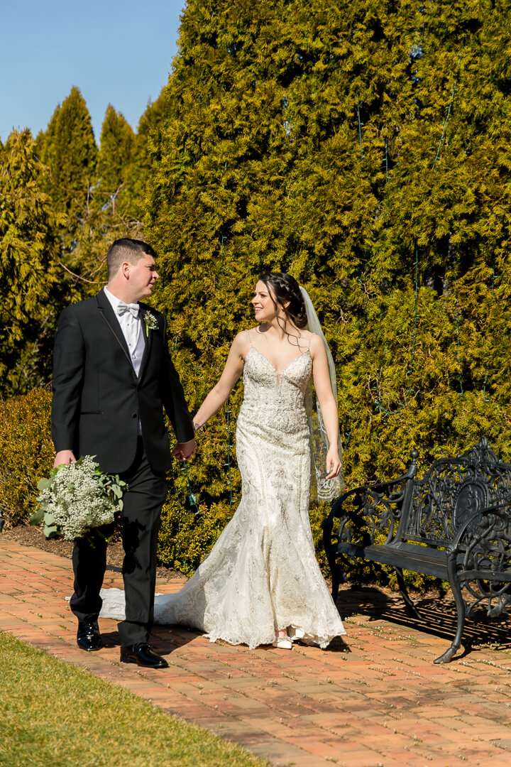 Bride and groom in the gardens at Park Savoy Estate, Northern NJ wedding photography by Alex Kaplan