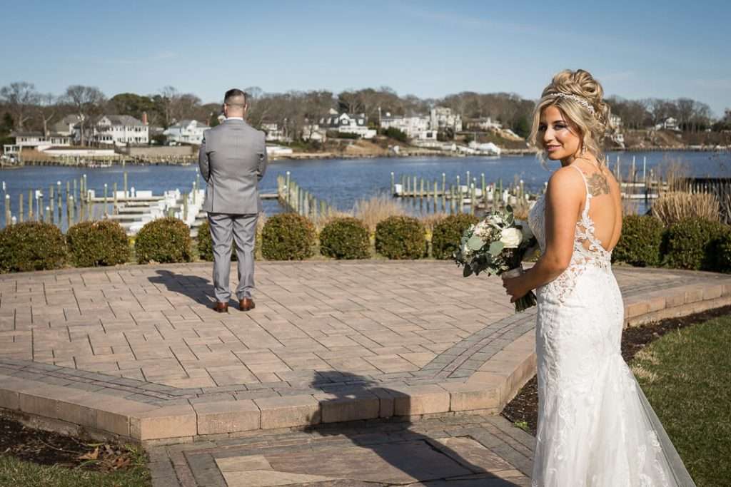 12-Crystal-Point-Yacht-Club-Bride-Approaching-Groom-First-Look-09771