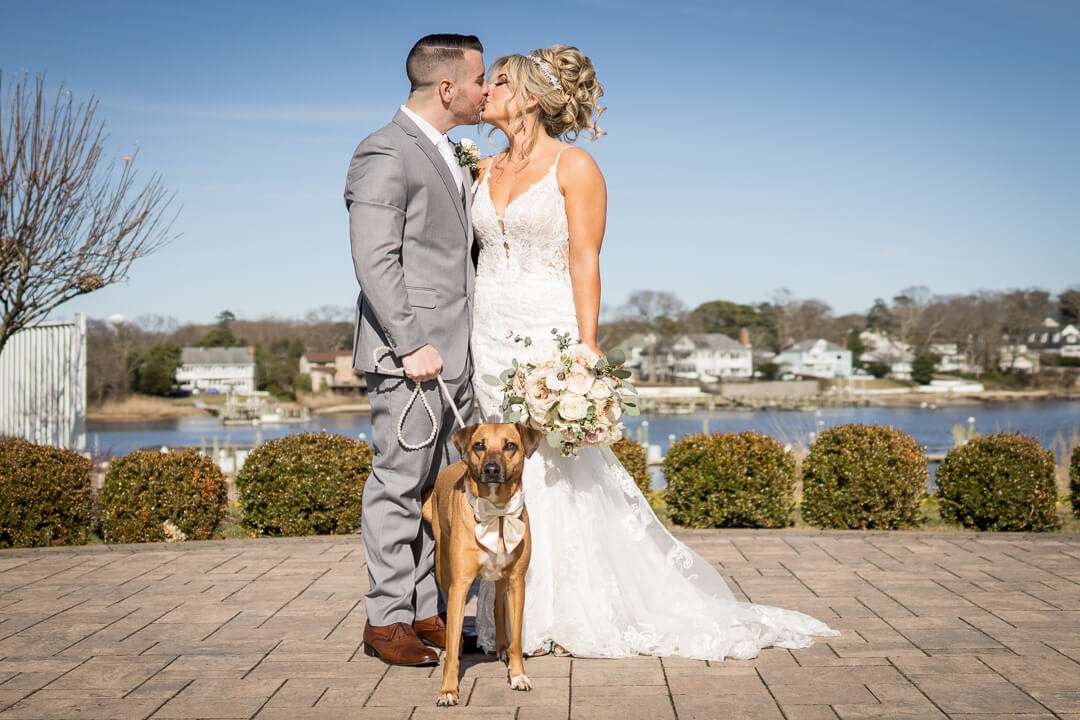 Crystal-Point-Yacht-Club-Bride-Groom-Kissing-with-Dog-09823