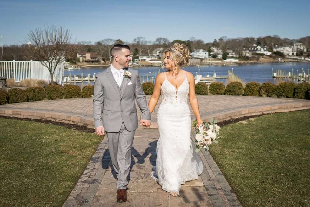 19-Crystal-Point-Yacht-Club-Bride-Groom-Holding-Hands-09927