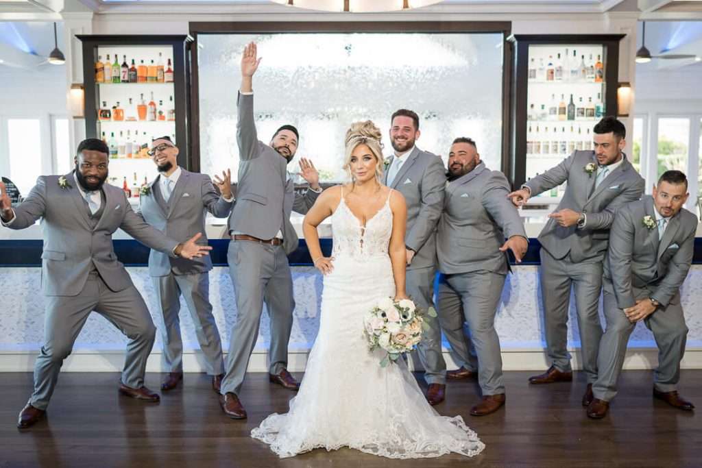 24_Bride_and_Groomsmen_Fun_Pose_Crystal_Point_Yacht_Clu