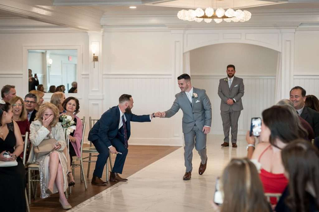 31_Groom_Entering_Ceremony_Crystal_Point_Yacht_Club