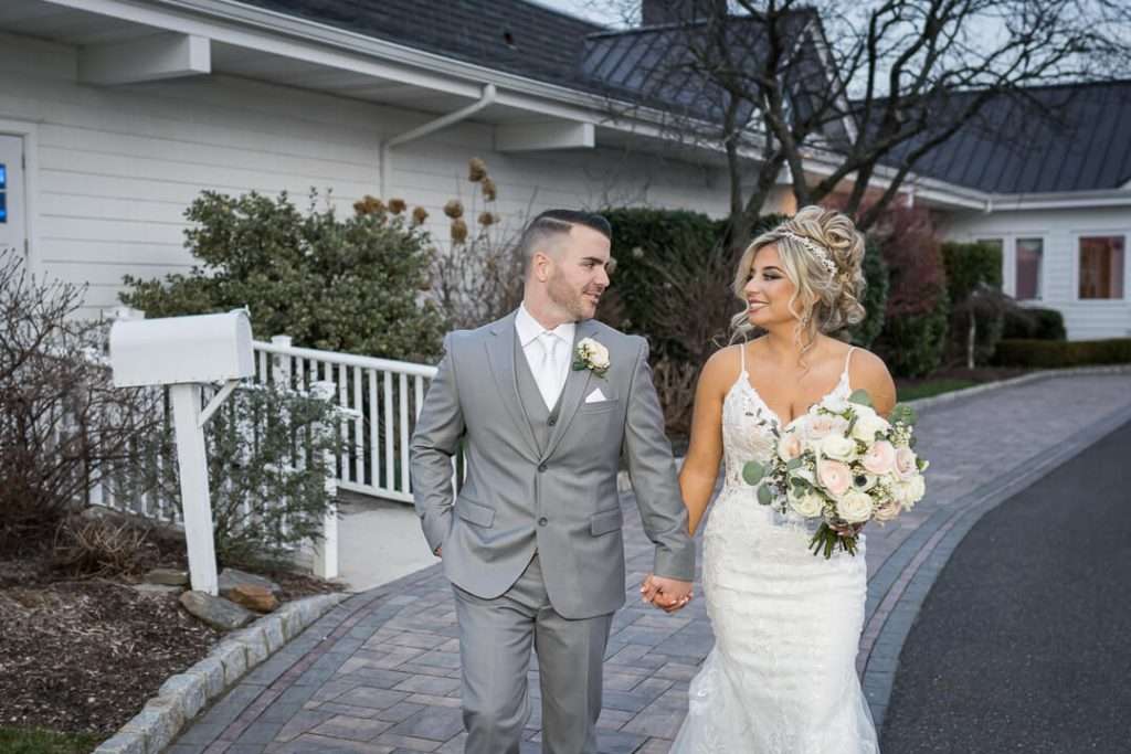 38-CrystalYachtClub-Bride-Groom-Walk-Hand-in-Hand