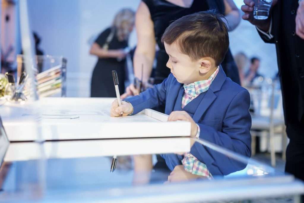 48- Ring-Bearer-Signing-Guestbook-Crystal-Point-Yacht-Club 