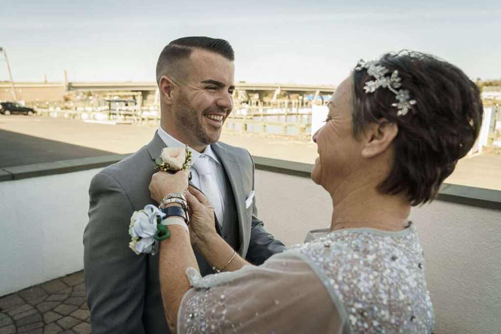 7- Groom-Mother-Boutonniere-Crystal-Point-Yacht-Club  