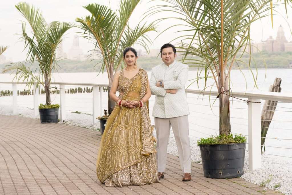 Close-up of Indian bride and groom smiling together at North Bergen NJ waterfront venue during reception