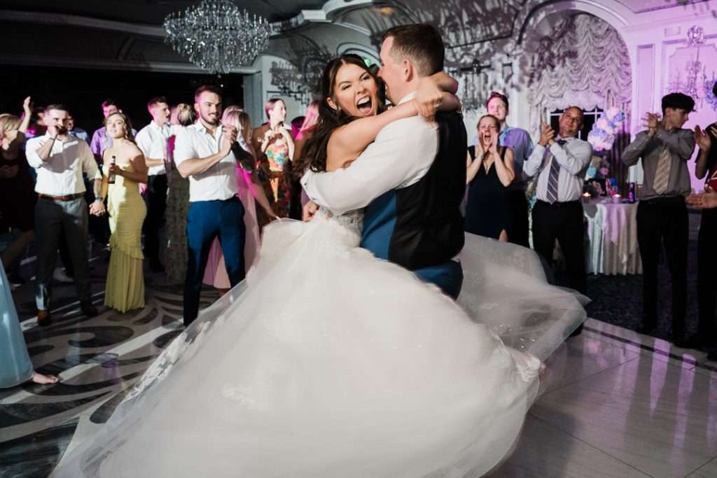 Bride and groom spinning on the dance floor during their first dance at elegant New Jersey wedding