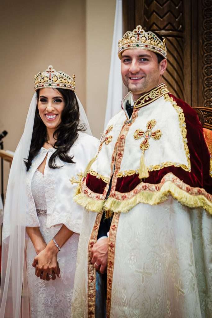  Coptic Orthodox bride and groom wearing traditional crowns and robes during NJ wedding