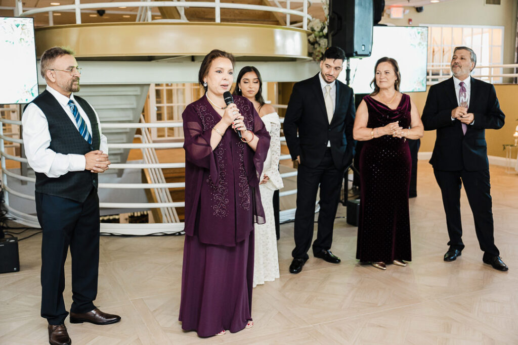 Family giving a heartfelt speech during wedding reception at The Armory NJ Restaurant in Perth Amboy, photographed by Alex Kaplan Photography.