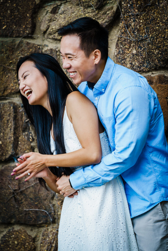 Genuine laughter captured during Deep Cut Gardens engagement photography session
