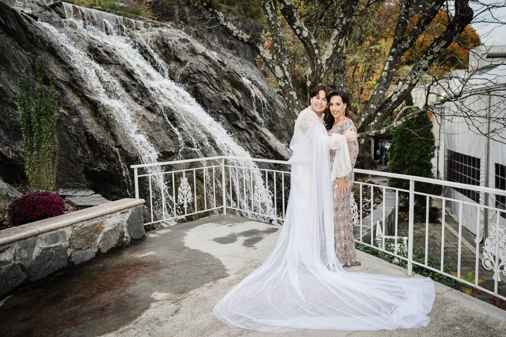 Bride with mother by waterfall at Cortlandt Colonial venue Hudson Valley wedding portrait