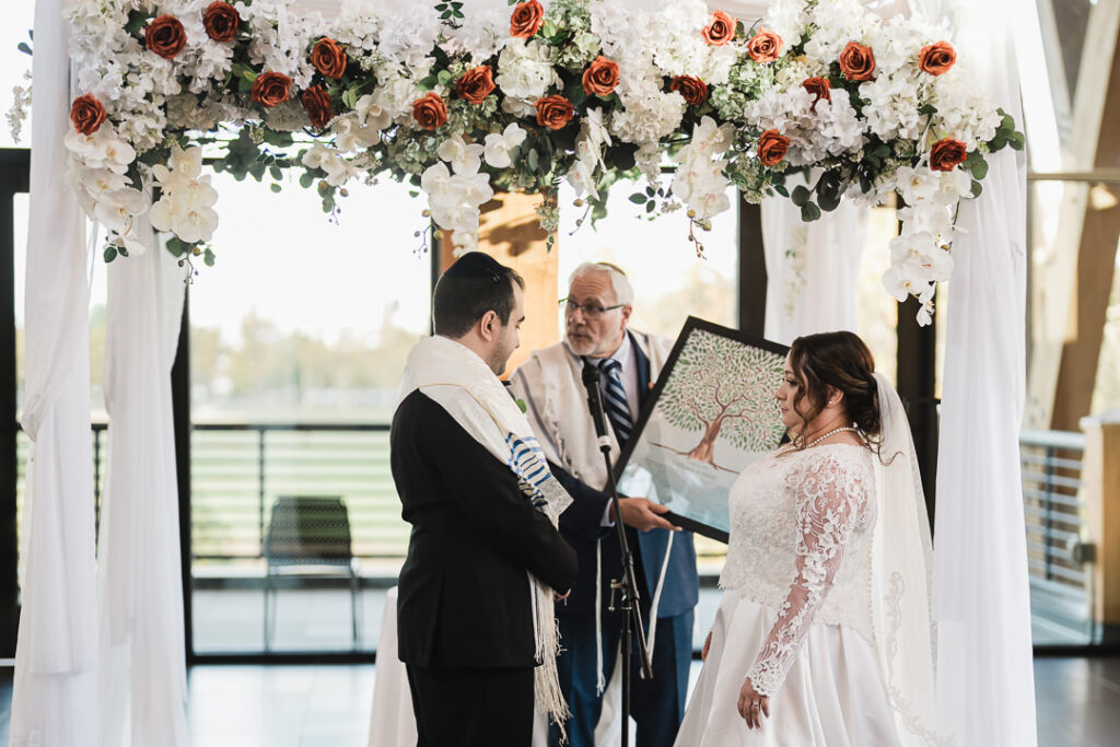 Floral chuppah with orchids and roses for Jewish ceremony at The View, Lincoln Park.