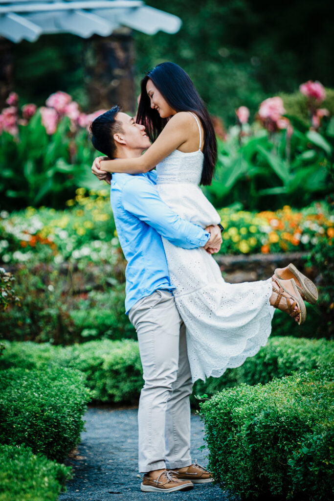 Couple on garden pathway during Deep Cut Gardens engagement photography session