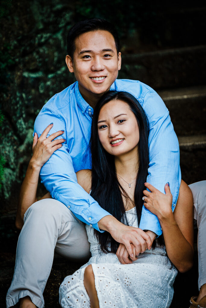 Close up of engaged couple sharing intimate moment at Deep Cut Gardens