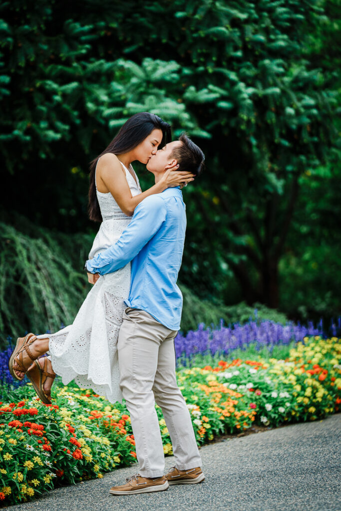 Couple kissing at Deep Cut Gardens during romantic engagement session