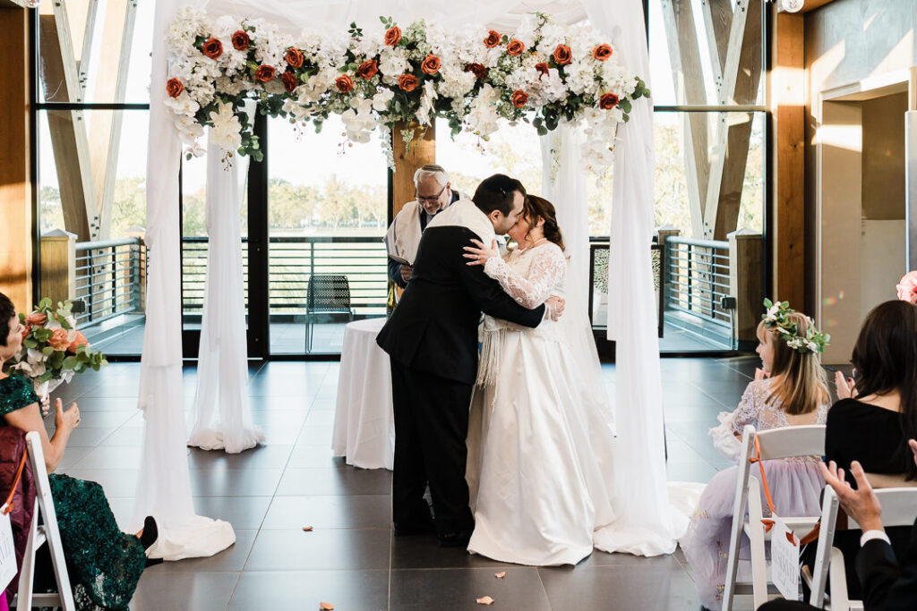 Reception room at The View with circular chandeliers and windows overlooking Lincoln Park.
