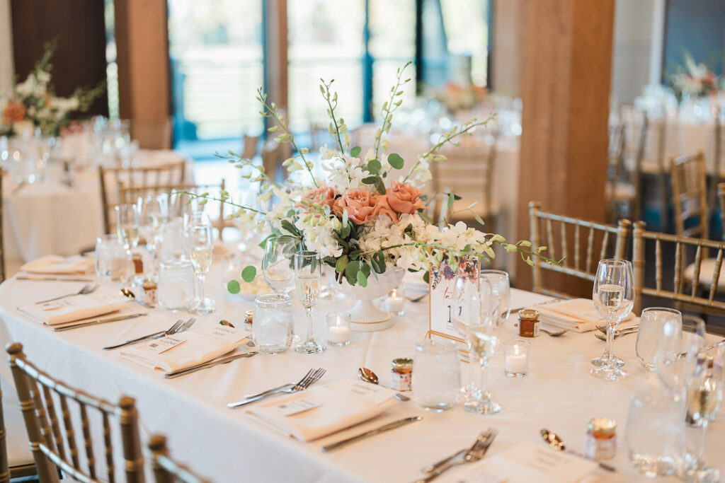 Elegant reception setup at The View with chandeliers and exposed beams.