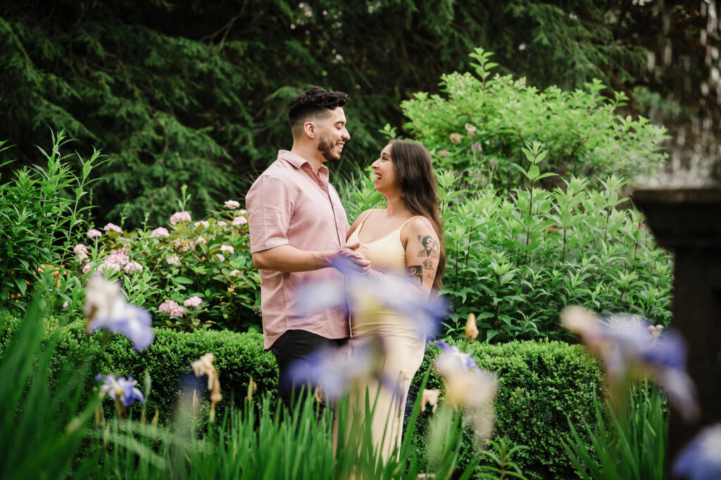 Bergen County engagement photographer Alex Kaplan captures couple among colorful iris flowers at garden estate