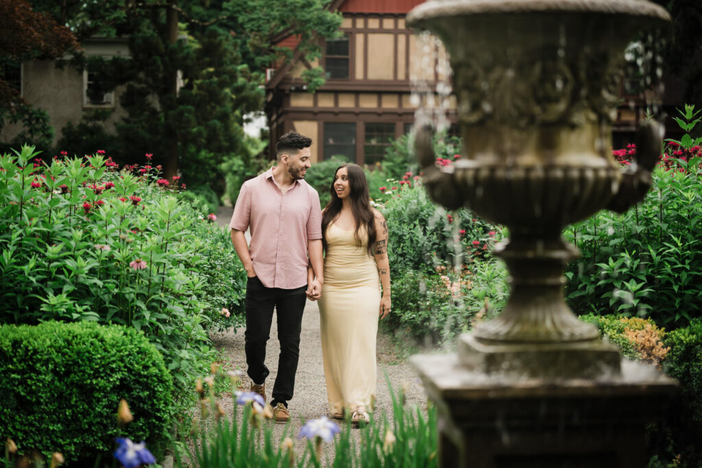 Bergen County proposal photographer Alex Kaplan creates romantic engagement portrait on garden path with ornate fountain