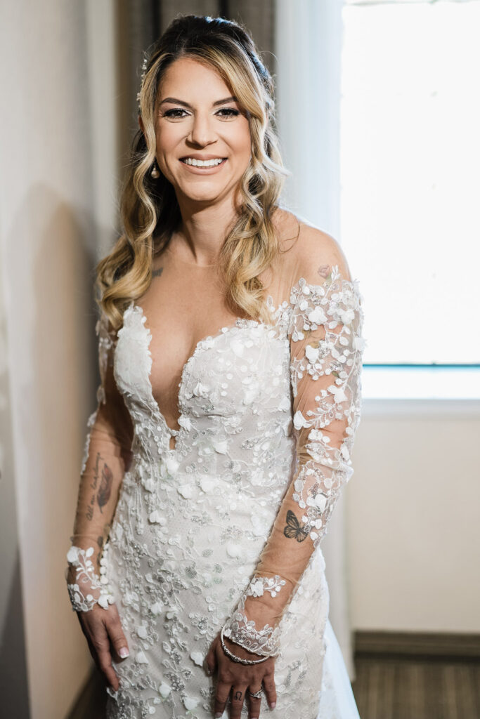 Bride portrait in Seng Couture lace wedding dress with illusion sleeves at The English Manor