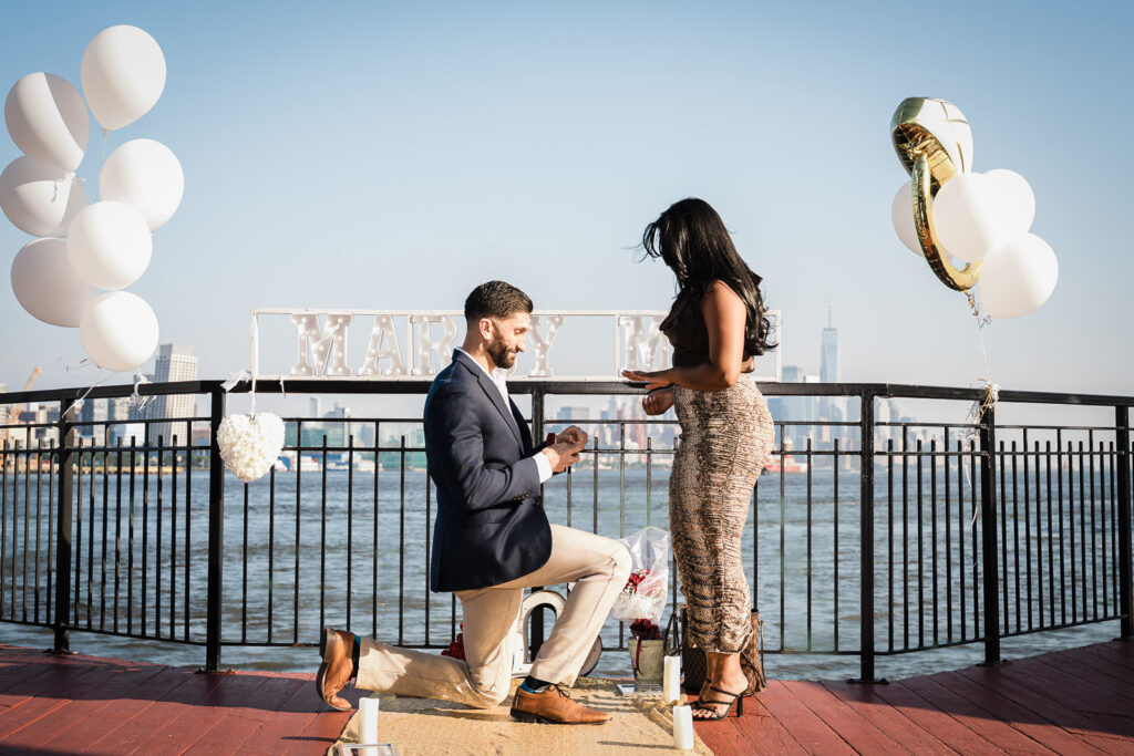 Chart House Weehawken rooftop proposal with Manhattan skyline by Alex Kaplan Photography