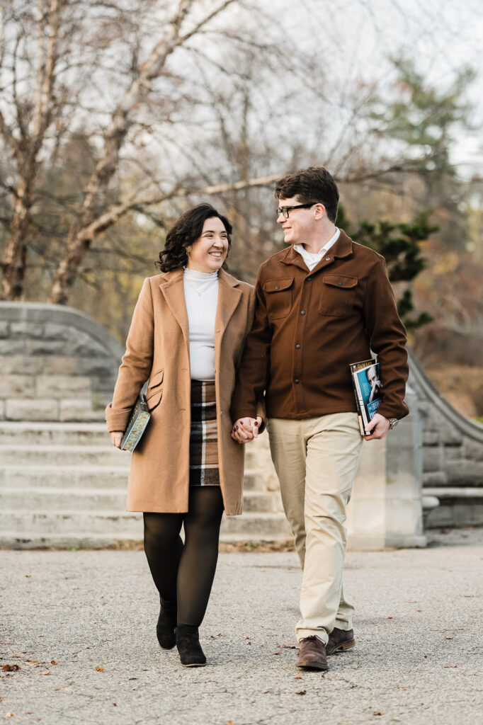 Couple walking and laughing together during fall engagement photography session in Verona NJ by Alex Kaplan