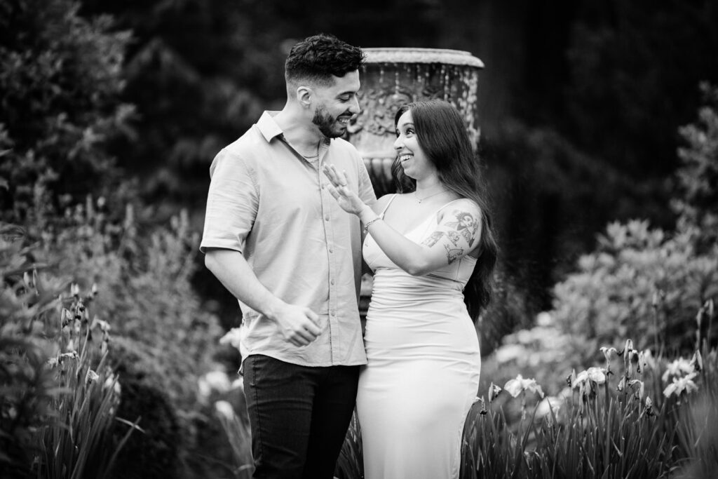 Alex Kaplan Northern New Jersey photographer creates artistic black and white engagement portrait near ornate garden fountain