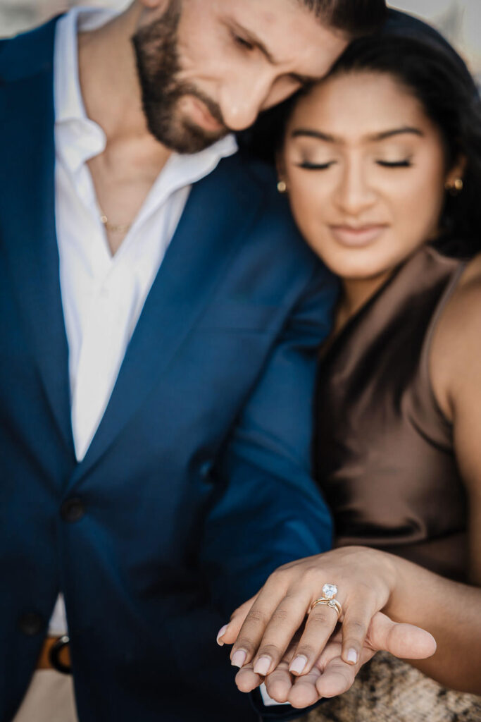 Engagement ring detail with intimate couple portrait by Alex Kaplan Photography