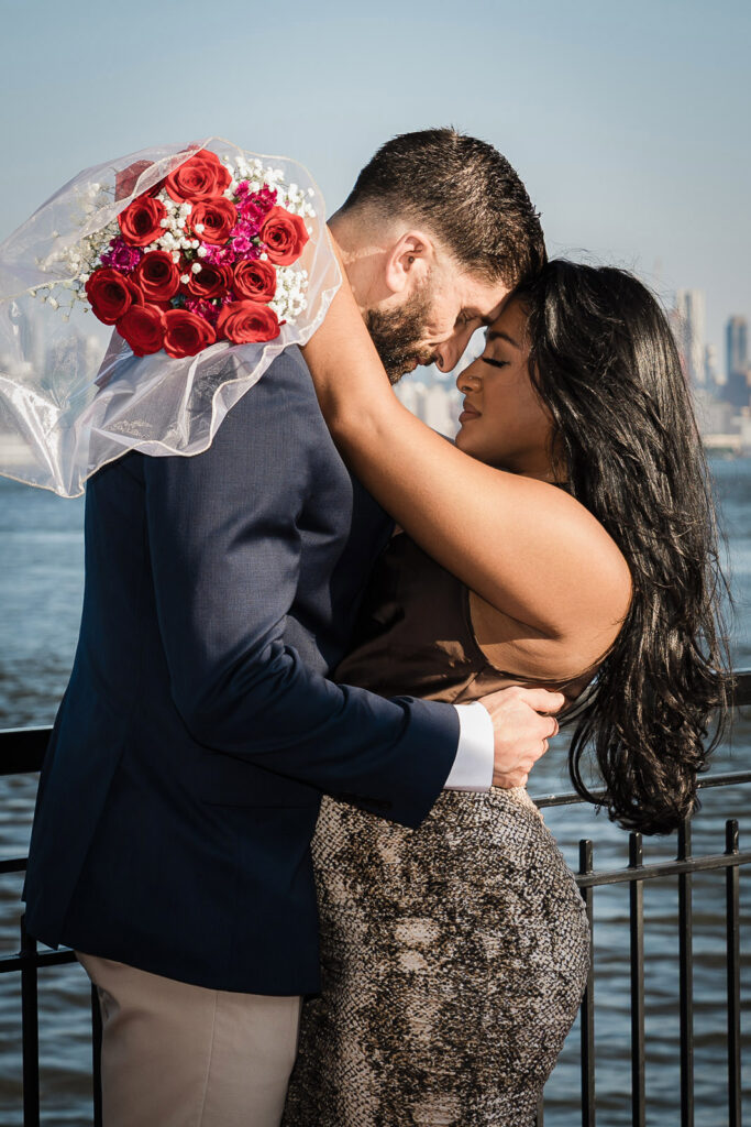 Intimate engagement portrait at NYC waterfront location by Alex Kaplan Photography
