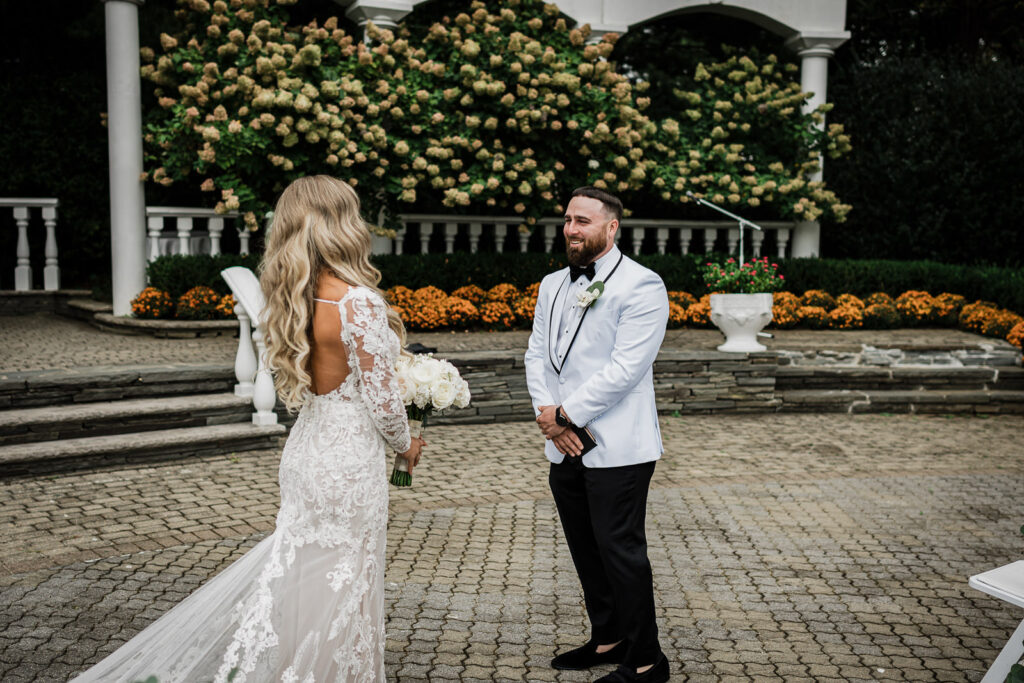 Couple facing each other during first look at Legacy Castle by Alex Kaplan