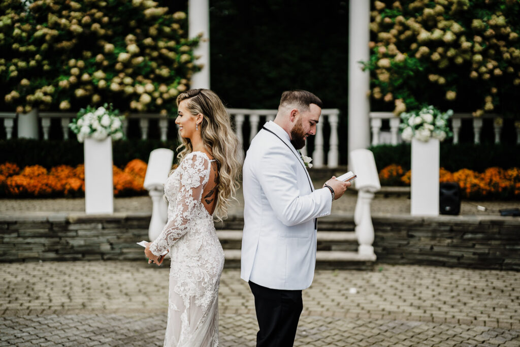 Couple exchanging vows during first look at The Legacy Castle by Alex Kaplan Photography