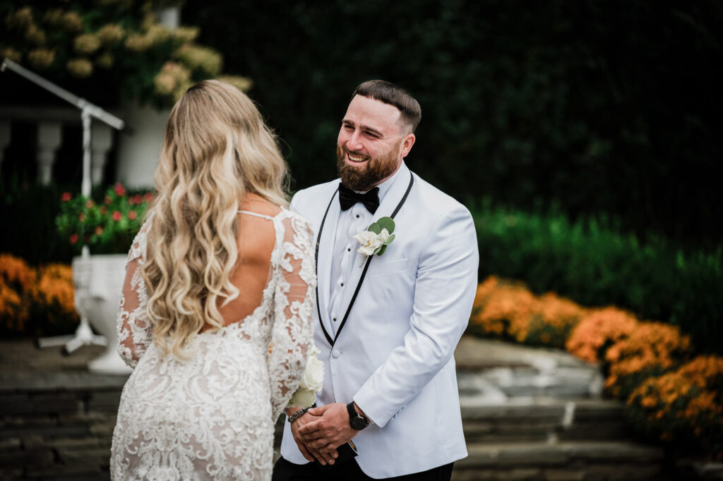 Groom emotional reaction during first look at The Legacy Castle by Alex Kaplan Photography
