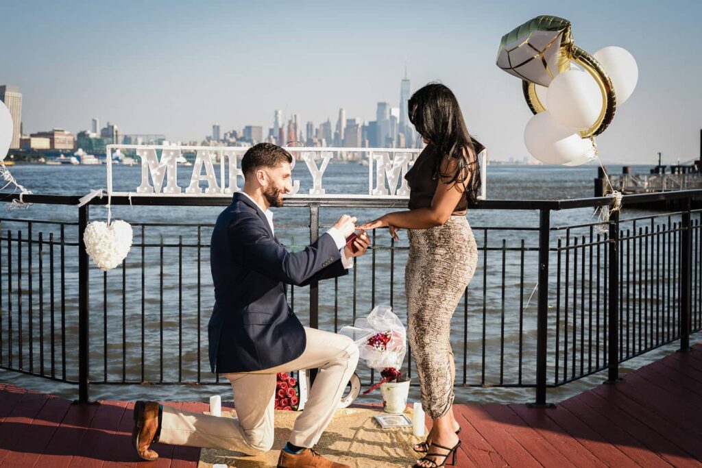 Chart House Weehawken rooftop proposal with Manhattan skyline by Alex Kaplan Photography