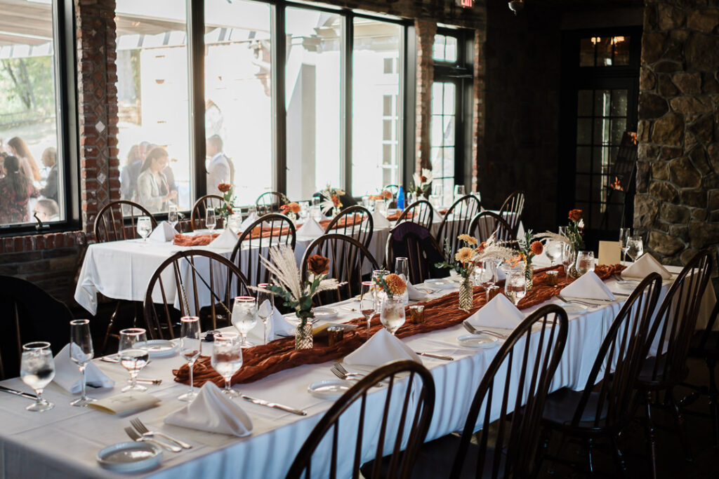 Natural light illuminates fall wedding tablescape at Mohawk House reception in Sparta New Jersey photographed by Alex Kaplan
