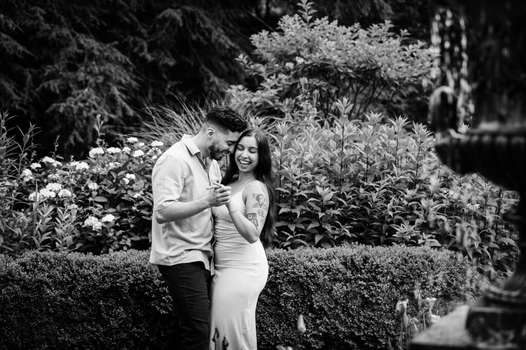 Northern NJ engagement photographer Alex Kaplan documents couple admiring engagement ring in classic black and white