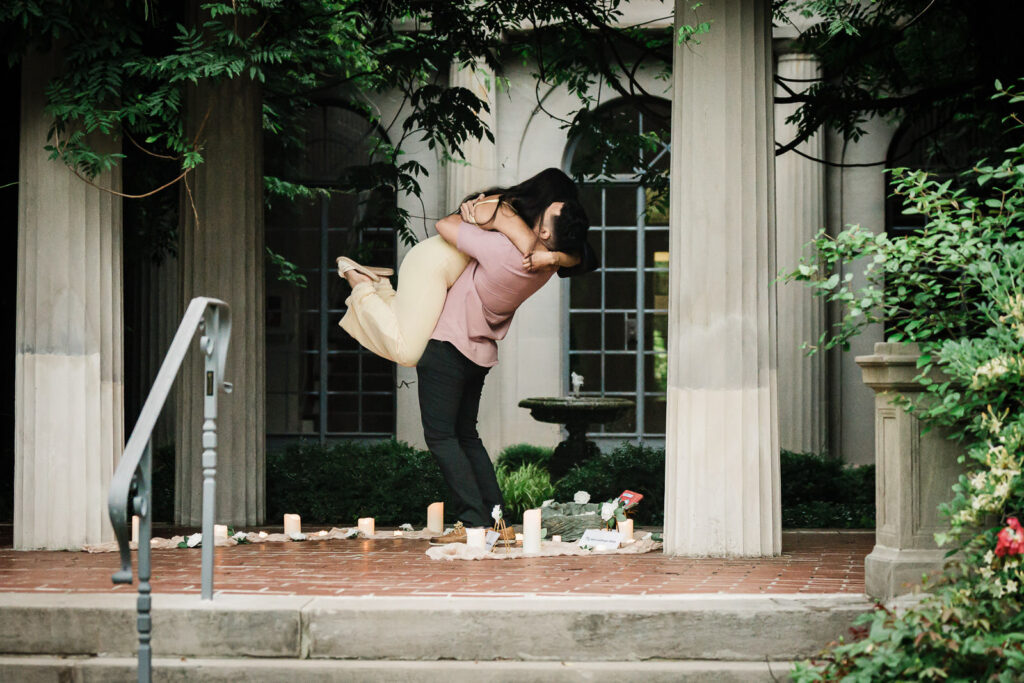 Bergen County engagement photographer Alex Kaplan documents joyful couple embracing after surprise garden proposal