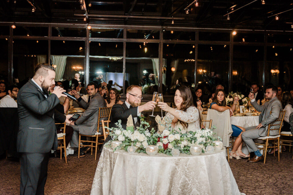 Bridesmaids speech with couple laughing at head table Ramsey Country Club by Alex Kaplan