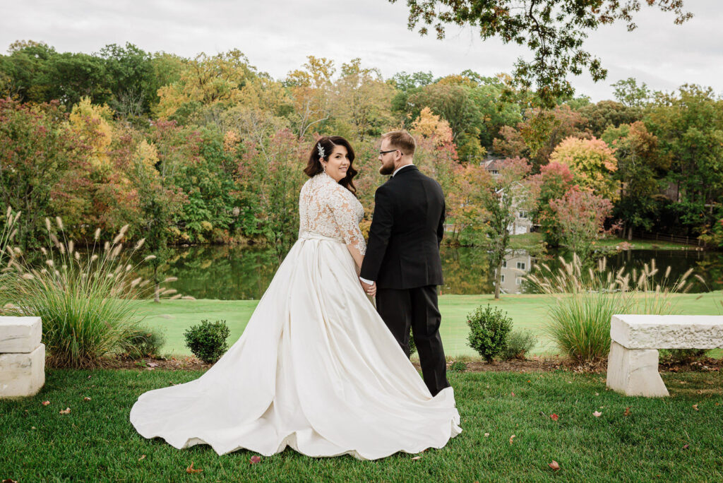 Couple portrait overlooking golf course at Ramsey Country Club fall wedding by Alex Kaplan