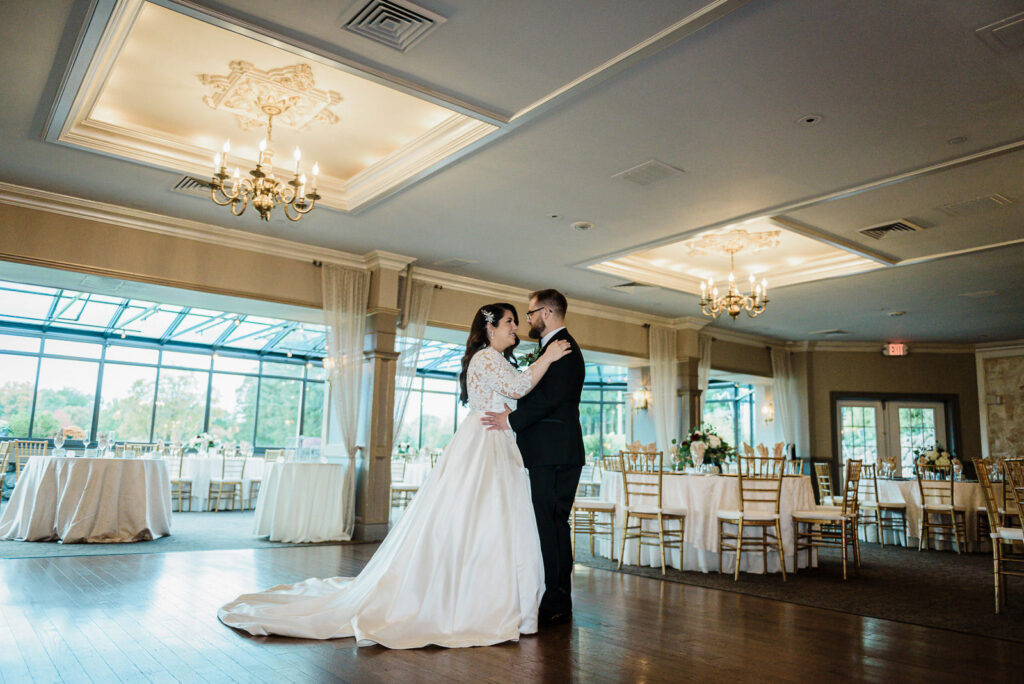 First dance in elegant ballroom at Ramsey Country Club wedding photographed by Alex Kaplan