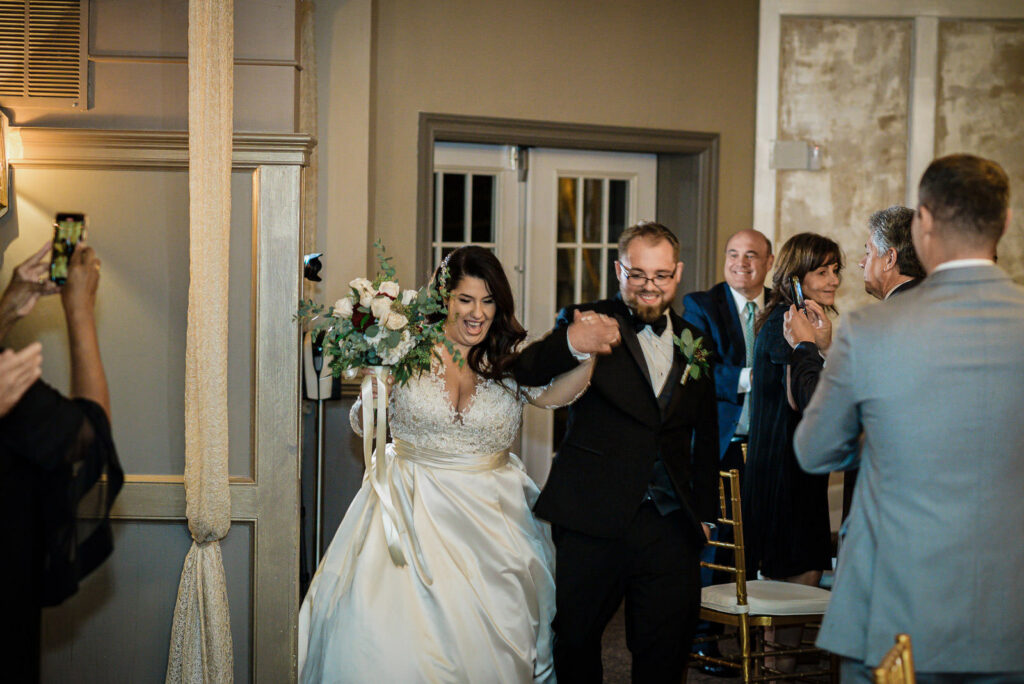 Toasts with champagne during reception at Ramsey Country Club by Alex Kaplan