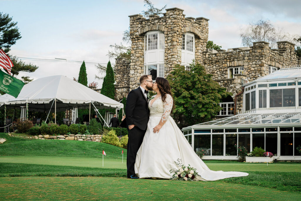 Couple at illuminated Abbey entrance twilight Ramsey Country Club photographed by Alex Kaplan